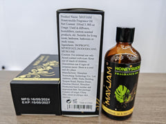 Close-up of MAYJAM Honeysuckle Fragrance Oil bottle