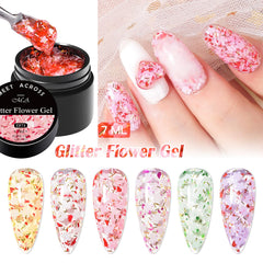 MEET ACROSS Glitter Flower Gel Nail Polish Set bottle closeup with flower embellishments and sequins.
