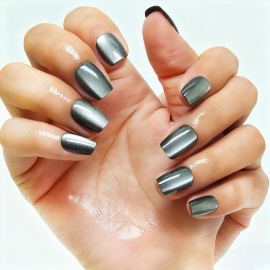 Melines black cat eye nails in Moonlight; quick at-home manicure option.