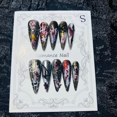 MellowBells Gothic press-on nails with dark accents for a bold party look