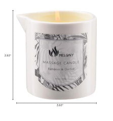 Pouring candle oil with soft glow and wooden spoon