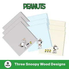 Smartphone screen being cleaned with Snoopy microfiber cloth