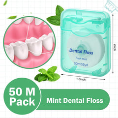 Close-up of mint green waxed dental floss 50m