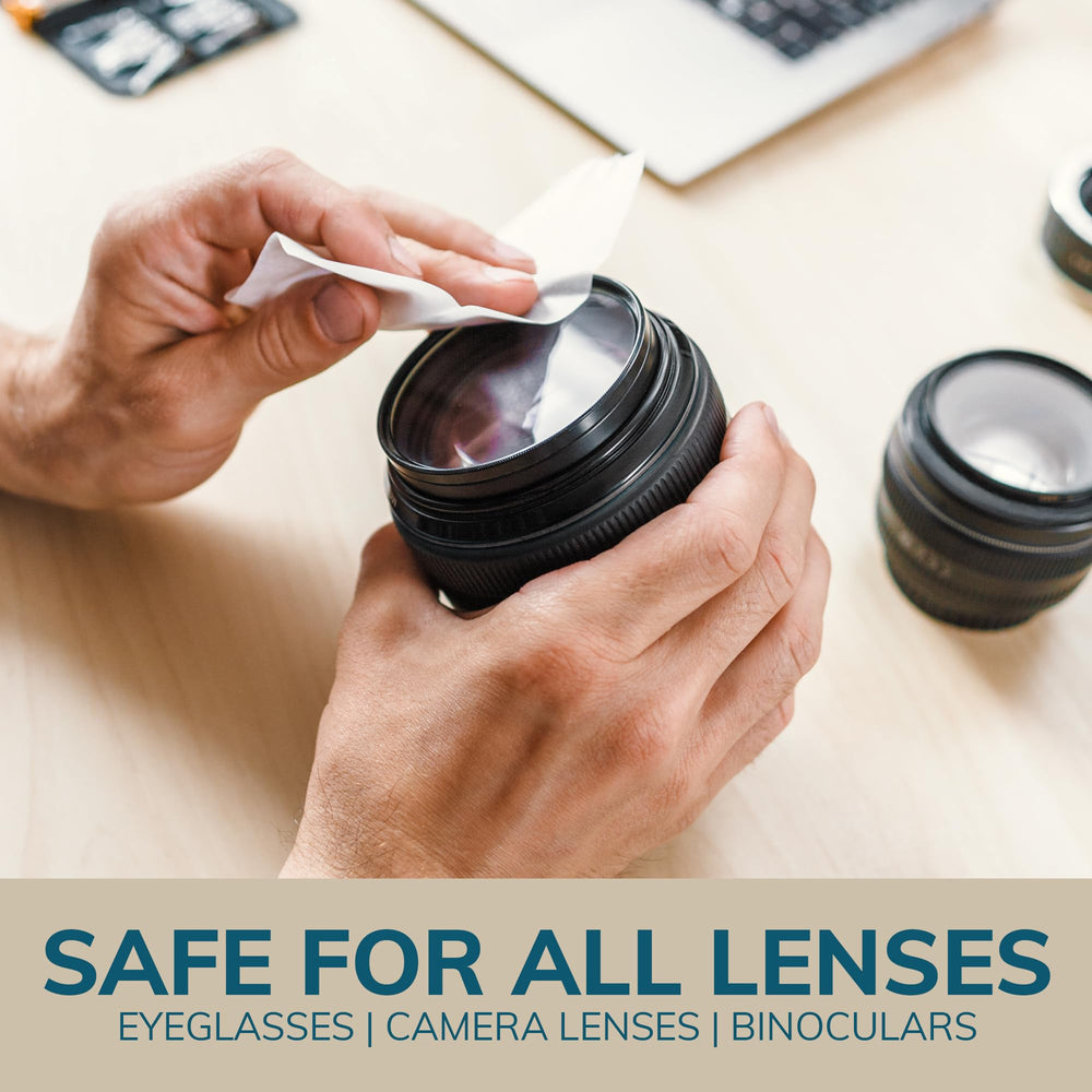 Close-up of wipe cleaning eyeglasses lenses