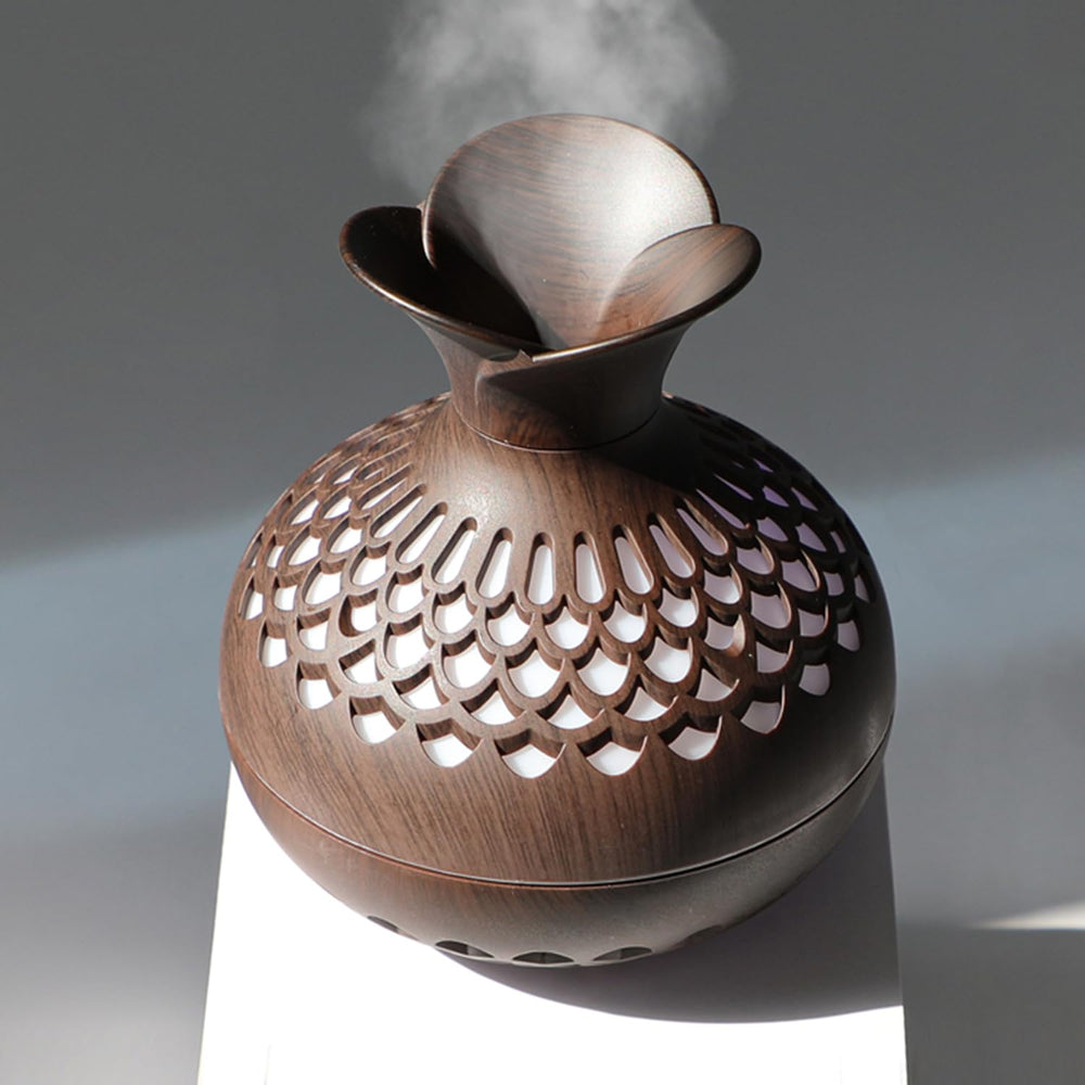 Mini humidifier on a desk with colorful LED lights