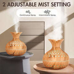 Mini humidifier beside a potted indoor plant