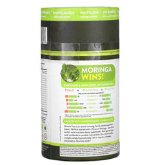 Moringa powder with fresh leaves arranged on a wooden board