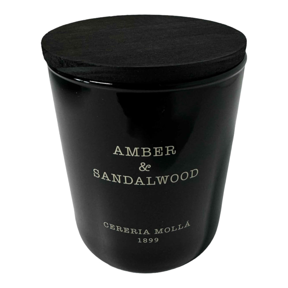 Molla 1899 handmade candle with amber-sandalwood glow for cozy, inviting spaces.