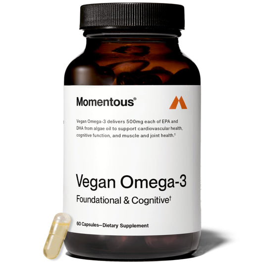 Momentous Vegan Omega-3 bottle and algae oil capsules