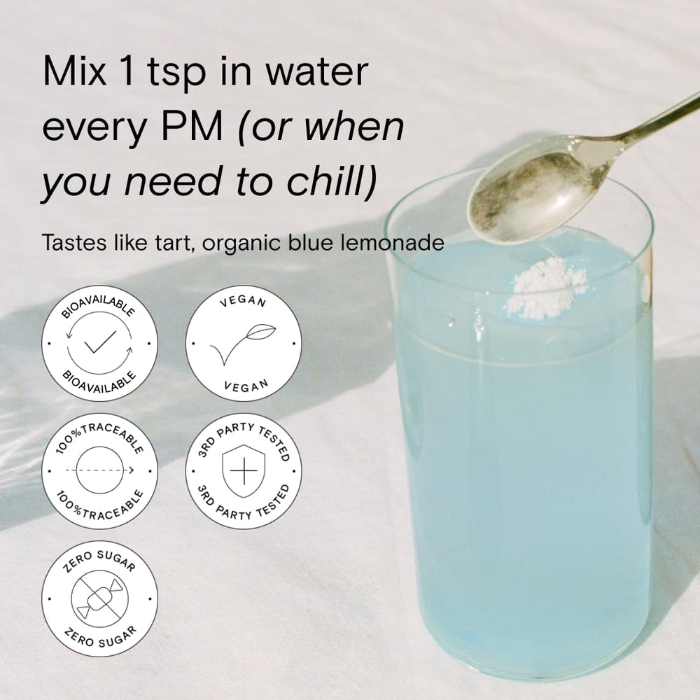Glass of water with Magnesi-Om Blue Lemon stick dissolving