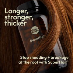 Moon Juice SuperHair capsules closeup highlighting vitamins for hair nourishment.