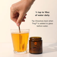 Dissolving Ting Mango B Complex in water with mango flavor