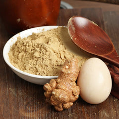Scoop with powder measuring 8.81 oz bottle
