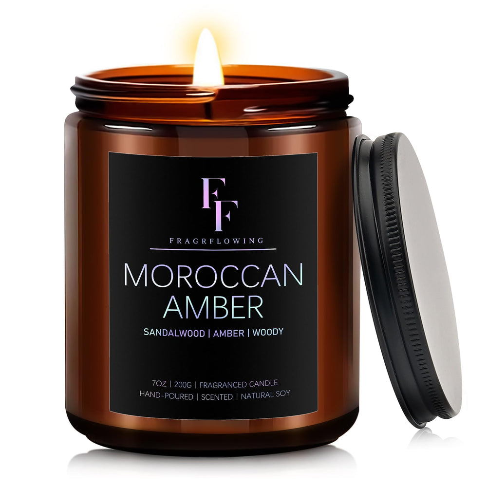7oz Moroccan Amber scented candle in a jar with warm glow