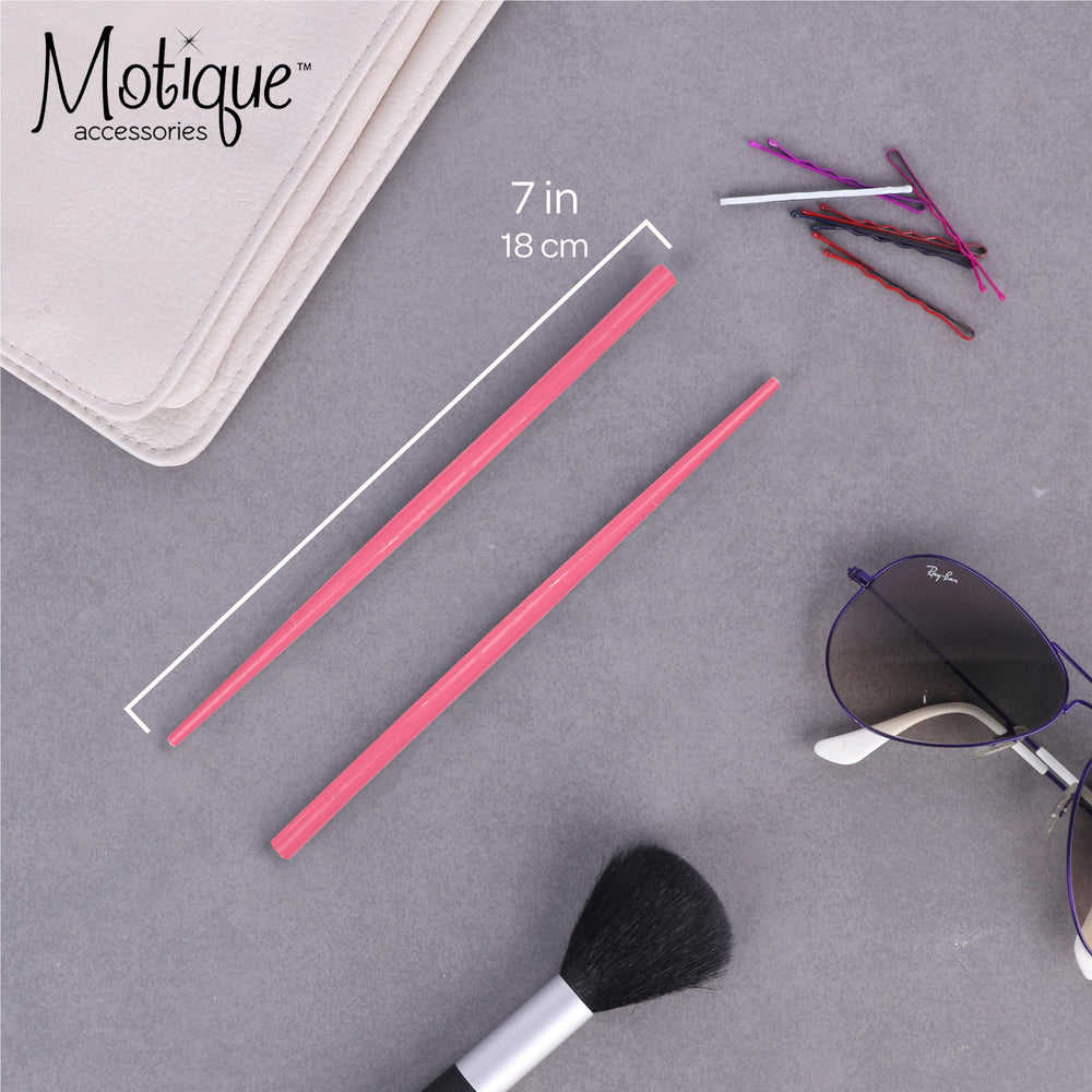 Motique Accessories wooden hair sticks closeup highlighting natural wood grain details.
