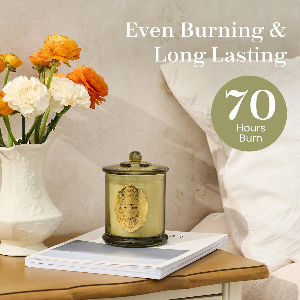 Sage Eucalyptus candle burning with soft glow