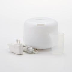 Muji MJ-UAD1 diffuser side view with soft ambient glow for night ambience