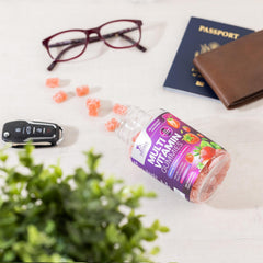 Gummy vitamins on white background with dosage information
