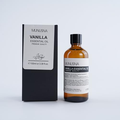 Vanilla essential oil with wooden spoon and bottle