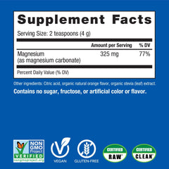 Spoon scooping CALM orange magnesium drink mix powder