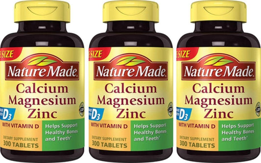 Front view of Nature Made Calcium Magnesium Zinc with Vitamin D tablets 300-count bottle in 3-pack