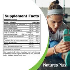 NaturesPlus Mega B-150 Complex tablets on a morning desk setup