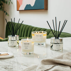 Neom Complete Bliss candle wick-trim-scene emphasizes proper care for clean burns and longer enjoyment.