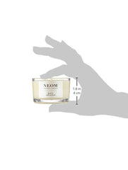 NEOM Complete Bliss candle lit, creating relaxing ambiance and focus.