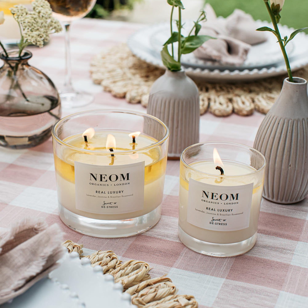 NEOM Real Luxury natural wax candle closeup highlights eco-friendly ingredients.