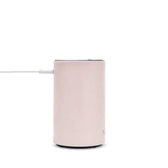 NEOM Wellbeing Pod Mini bedside setup creating relaxing ambience