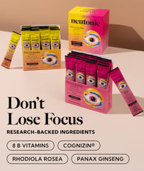 Neutonic Wild Berry stick-pack beside water for study sessions