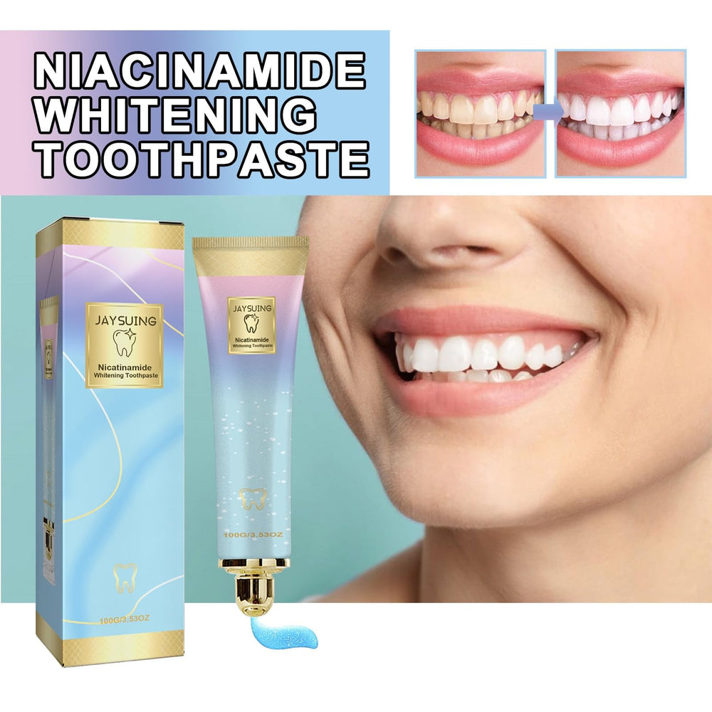 Toothpaste tube squeezed with peach-flavored paste on a toothbrush