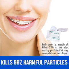 Night guard being cleaned with denture cleaning tablets in warm water
