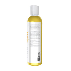 Hands applying Arnica Soothing Massage Oil to demonstrate texture