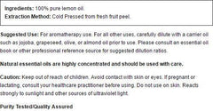 Close-up of lemon essential oil bottle