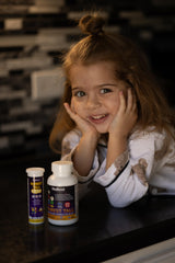 Kids enjoying NuBest Tall Fizzy orange-flavored drink