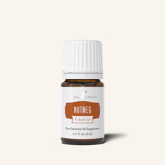Young Living Nutmeg Vitality amber oil bottle signals premium culinary use.