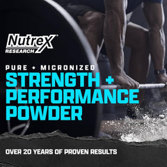 Close-up of Nutrex creatine monohydrate powder being mixed in a drink
