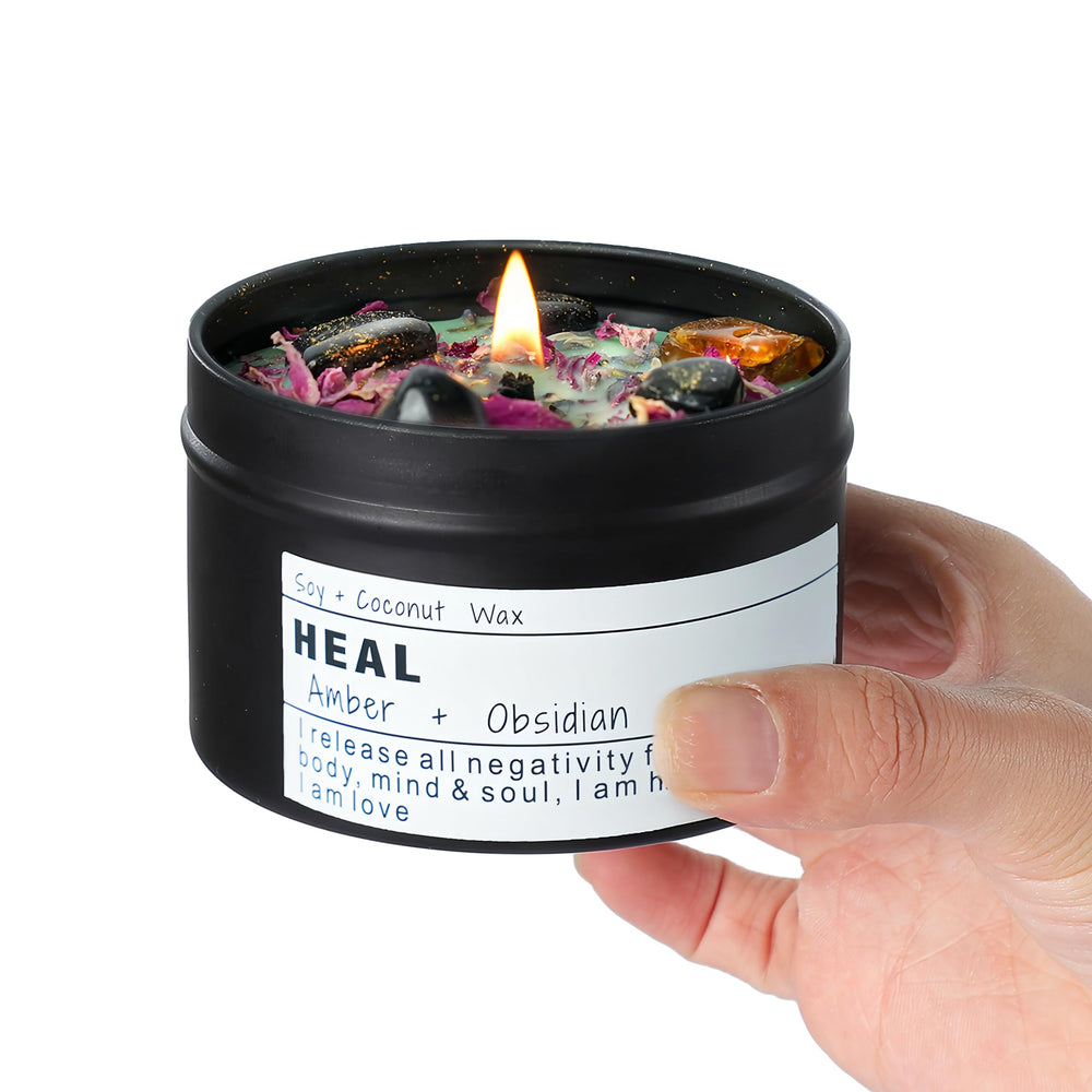 Front view of Obsidian Crystal Energy Candle in an 8oz tin with dried flowers
