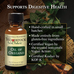 Dropper releasing a single drop of oregano oil