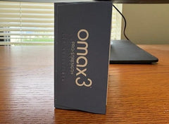 Omax3 branding with bottle and box