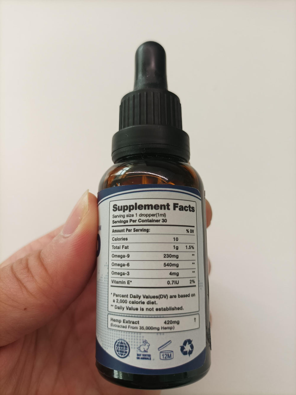 Close-up of CHANUB4ITO Omega 3-6-9 oil bottle - 4 pack