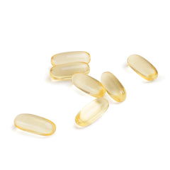 60 softgels arranged on white background