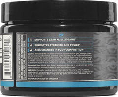 Athlete mixing creatine powder in shaker bottle