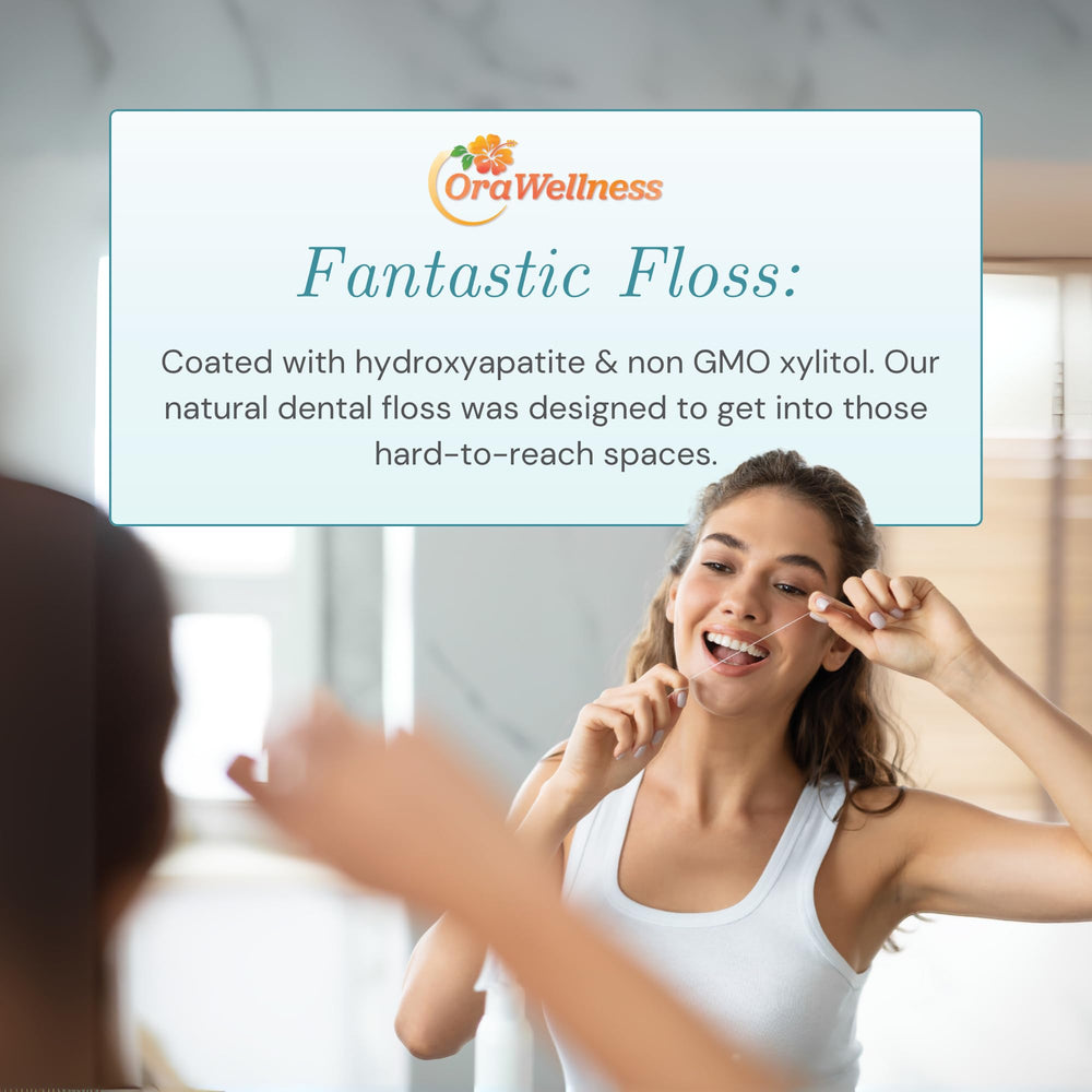 Waxed dental floss strands coated with hydroxyapatite