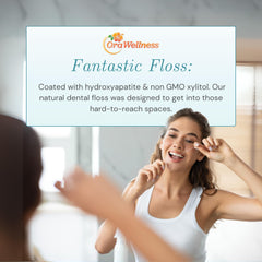 Waxed dental floss strands coated with hydroxyapatite