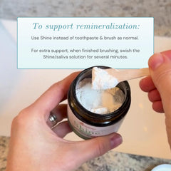 Applying Shine Tooth Powder to a toothbrush