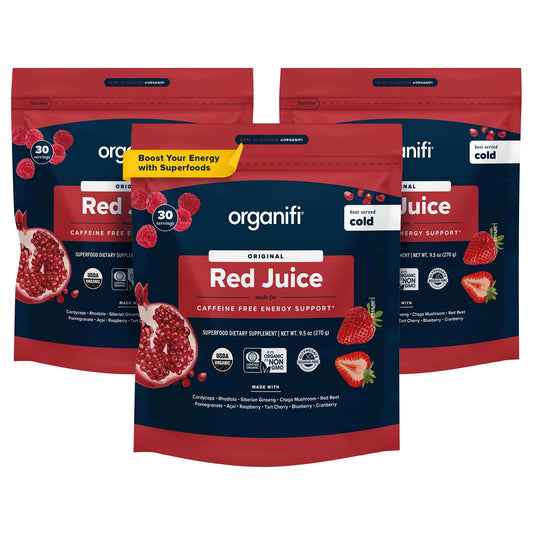 Organifi Red Juice bottle with a glass of prepared drink