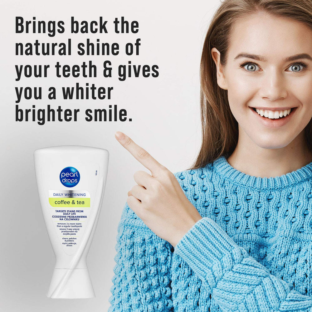 Toothbrush with Pearl Drops Daily Stains toothpaste on bathroom counter