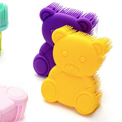 Penepico bear-yellow bath brush in use as a two-in-one tool